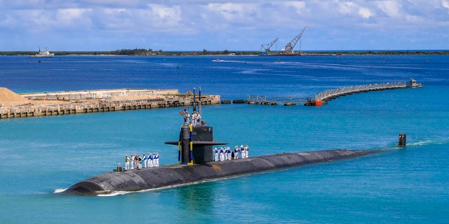 In this photo provided by the US Navy, the Los Angeles-class fast attack submarine USS Oklahoma City (SSN 723) returns to Naval Base Guam on August 19, 2021 (Mass Communication Specialist 3rd Class Naomi Johnson / US Navy via AP)