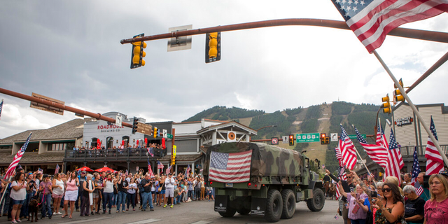 Community members honor Marine Lance Cpl. Rylee McCollum during a procession in Jackson, Wyo., Friday, Sept. 10, 2021.