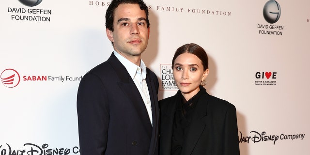 (L-R) Louis Eisner and Ashley Olsen attend an event in Los Angeles, California.