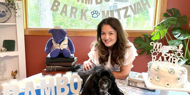 Rambo's "Bark Mitzvah" was outfitted with personalized decor. The 13-year-old Havenese pup also received special dog-sized attire and peanut butter cake. Here he sits with his owner Ruth Ellenberg.