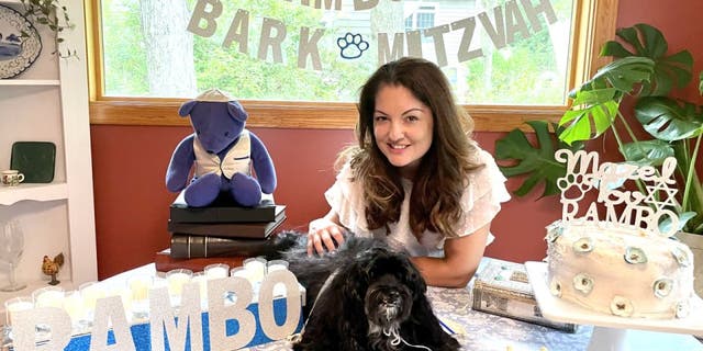 Rambo's "Bark Mitzvah" was outfitted with personalized decor. The 13-year-old Havenese pup also received special dog-sized attire and peanut butter cake. Here he sits with his owner Ruth Ellenberg.