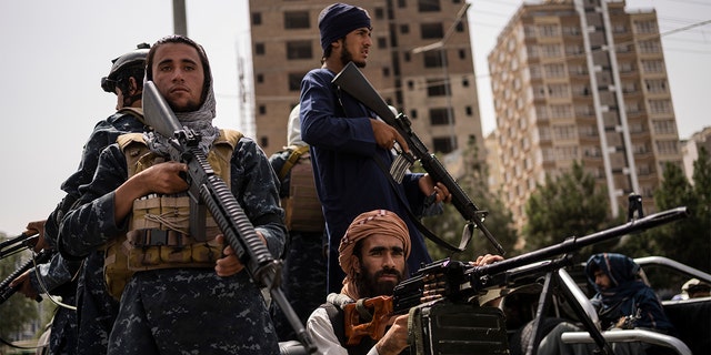 Taliban fighters outside Kabul University, Afghanistan.