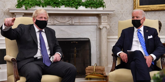 US President Joe Biden (R) holds a bilateral meeting with Britain's Prime Minister Boris Johnson at the Oval Office of the White House in Washington, DC on September 21, 2021. (Photo by Nicholas Kamm / AFP) (Photo by NICHOLAS KAMM/AFP via Getty Images)