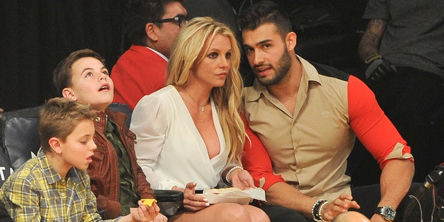 Sean Federline, Jayden James Federline, Britney Spears and Sam Asghari attend a basketball game between the Los Angeles Lakers and the Golden State Warriors at Staples Center on November 29, 2017 in Los Angeles, California.  