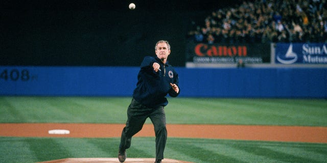President George W. Bush throws the ceremonial first pitch before the third game of the 2001 World Series between the Arizona Diamondbacks and the New York Yankees at Yankee Stadium on October 30, 2001 in Bronx, New York. The Yankees defeated the Diamondbacks 2-1. (Photo by Rich Pilling / MLB via Getty Images)