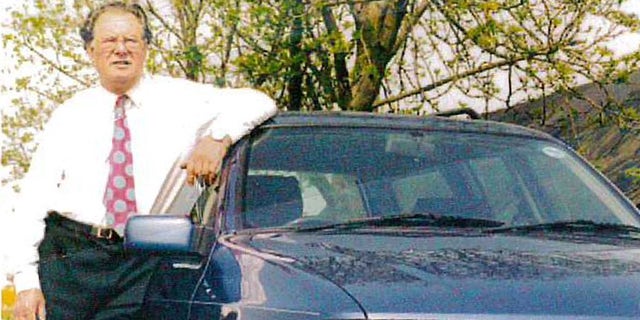 George Allen seen with the newest car in the collection, a 1991 Ford Sierra Estate.