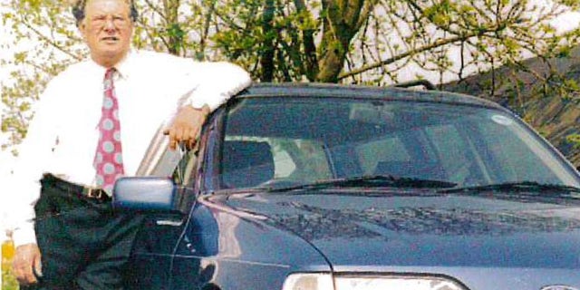 George Allen seen with the newest car in the collection, a 1991 Ford Sierra Estate.