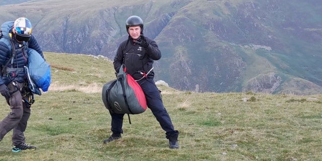 Tom Cruise landed his helicopter in England's Lake District and surprised some hikers.