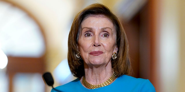Speaker of the House Nancy Pelosi, D-Calif., talks to reporters at the Capitol in Washington, Wednesday, Sept. 22, 2021
