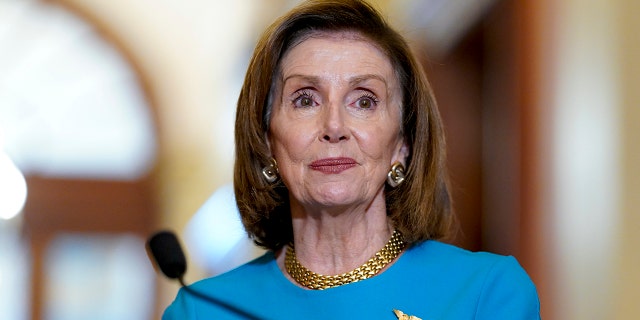 Speaker of the House Nancy Pelosi, D-Calif., talks to reporters at the Capitol in Washington, Wednesday, Sept. 22, 2021