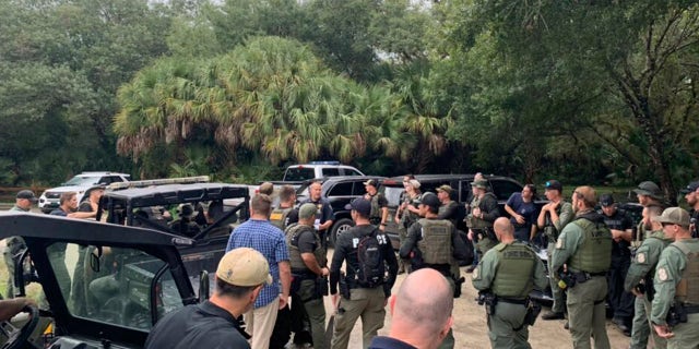 Law enforcement officers will conduct a search on Saturday, September 18, 2021, in the vast Carlton Reserve in Sarasota, Florida, for Brian Laundry. (Via North Port Police Department AP)