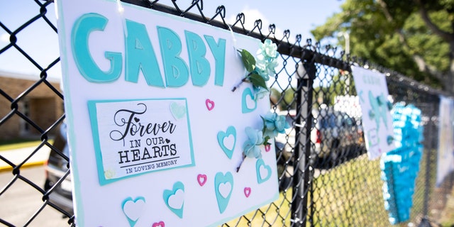 A sign is seen during Gabby Petito's memorial service in Holbrook, New York, U.S., September 26, 2021.  