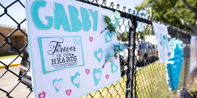 A sign is seen during Gabby Petito's memorial service in Holbrook, New York, U.S., September 26, 2021.