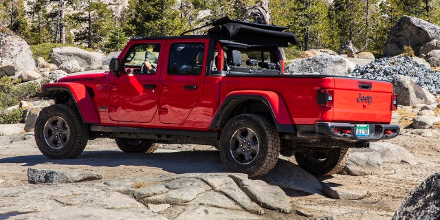 The Gladiator's standard doors have full frames and glass windows.