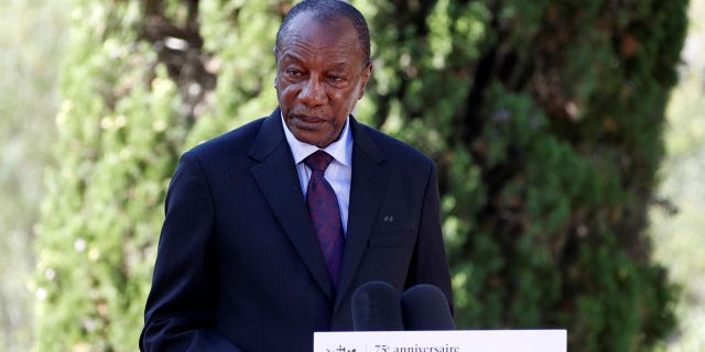 In this Thursday, Aug. 15, 2019 file photo, Guinean President Alpha Conde delivers a speech during a ceremony marking the 75th anniversary of the WWII Allied landings in Provence, in Saint-Raphael, southern France. Witnesses say heavy gunfire has erupted near the presidential palace in Guinea's capital and went on for hours. It was not immediately known whether President Alpha Conde was home at the time the shooting began. But the gunfire prompted security concerns in the West African country with a long history of coup attempts. (Eric Gaillard/Pool Photo via AP, File)