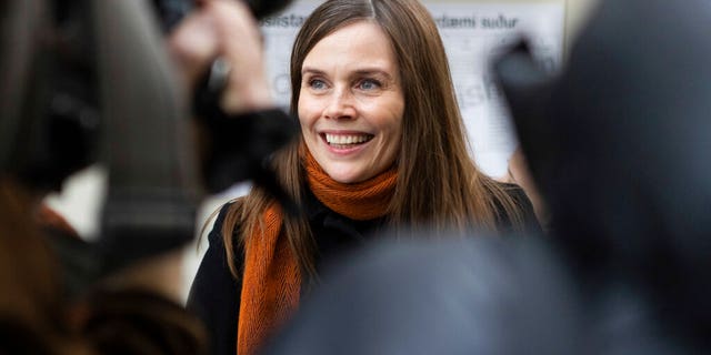 Iceland's Prime Minister Katrin Jakobsdottir speaks to the media after voting at a polling station in Reykjavik, Iceland, Saturday, Sept. 25, 2021. (AP Photo/Arni Torfason)