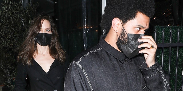 Angelina Jolie (L) and The Weeknd (R) dined together at Giorgio Baldi.