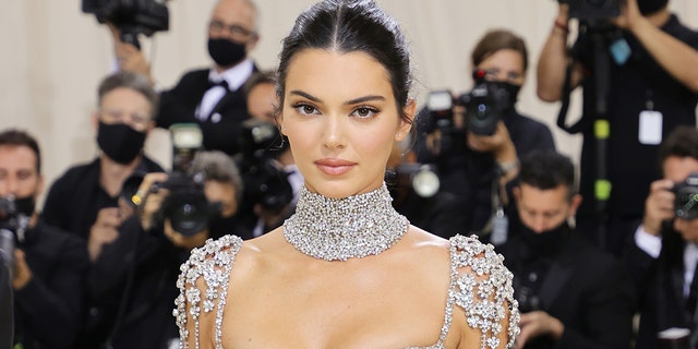Kendall Jenner went through some of her iconic looks during an interview with Vogue, which including the see through top she wore during her first high-end fashion show. 