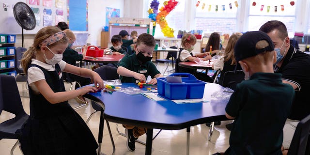 Students wear masks during classroom activities.