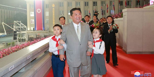 In this photo provided by the North Korean government, North Korean leader Kim Jong Un walks with children during a celebration of the nation’s 73rd anniversary at Kim Il Sung Square in Pyongyang, North Korea, early Thursday, Sept. 9, 2021. Independent journalists were not given access to cover the event depicted in this image distributed by the North Korean government. The content of this image is as provided and cannot be independently verified. Korean language watermark on image as provided by source reads: "KCNA" which is the abbreviation for Korean Central News Agency. (Korean Central News Agency/Korea News Service via AP)