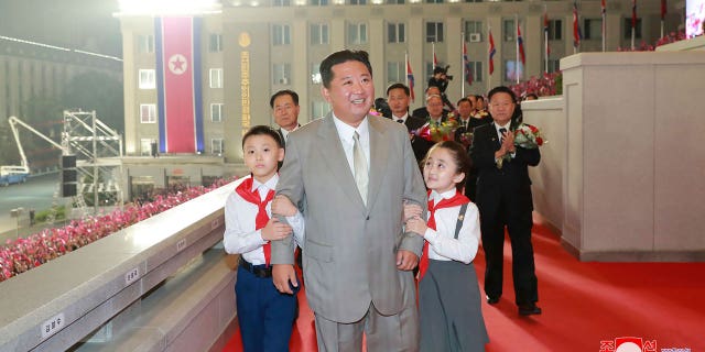 In this photo provided by the North Korean government, North Korean leader Kim Jong Un walks with children during a celebration of the nation’s 73rd anniversary at Kim Il Sung Square in Pyongyang, North Korea, early Thursday, Sept. 9, 2021. Independent journalists were not given access to cover the event depicted in this image distributed by the North Korean government. The content of this image is as provided and cannot be independently verified. Korean language watermark on image as provided by source reads: "KCNA" which is the abbreviation for Korean Central News Agency. (Korean Central News Agency/Korea News Service via AP)