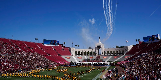 Airplanes fly over Los Angeles Memorial Coliseum before an NCAA college football game between San Jose State and Southern California Saturday, Sept. 4, 2021, in Los Angeles. (AP Photo/Ashley Landis)