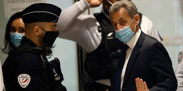 In this March 1, 2021 file photo, former French President Nicolas Sarkozy arrives at the courtroom in Paris. Former French President Nicolas Sarkozy was found guilty Thursday of illegal campaign financing of his unsuccessful 2012 reelection bid. (AP Photo/Michel Euler, File)