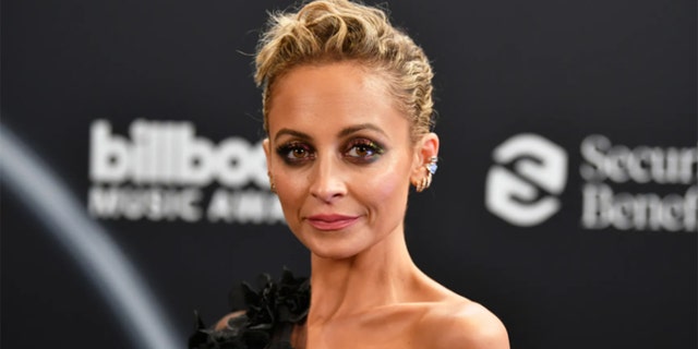 Nicole Richie posed for a glamorous holiday photo shoot, joking that her famous family "forgot" to take photos this year.