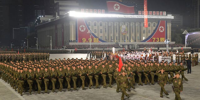 In this photo provided by the North Korean government, North Korean soldiers parade during a celebration of the nation’s 73rd anniversary that was overseen by leader Kim Jong Un, at Kim Il Sung Square in Pyongyang, North Korea, early Thursday, Sept. 9, 2021. Independent journalists were not given access to cover the event depicted in this image distributed by the North Korean government. The content of this image is as provided and cannot be independently verified. Korean language watermark on image as provided by source reads: "KCNA" which is the abbreviation for Korean Central News Agency. (Korean Central News Agency/Korea News Service via AP)