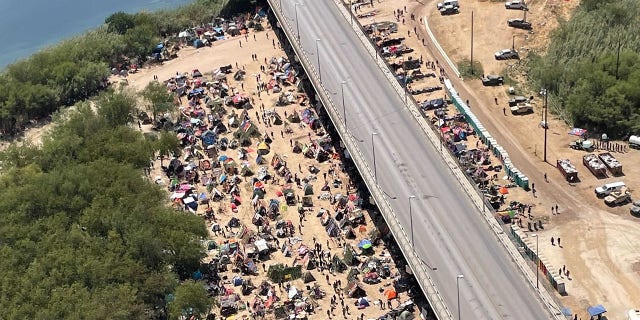 Sept. 18, 2021: Migrants camp under the International Bridge in Del Rio. [Rep. Pfluger.)