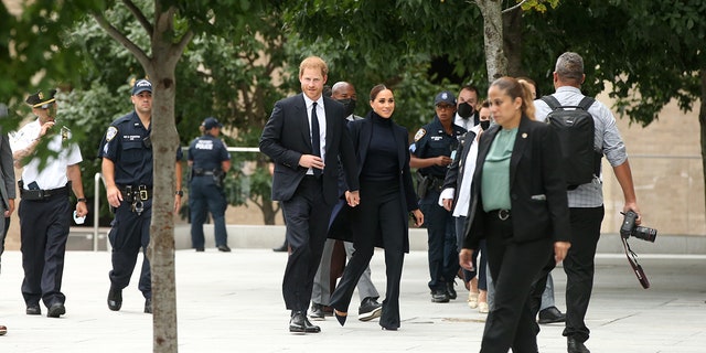 The Sussexes donned dark outfits for the occasion.
