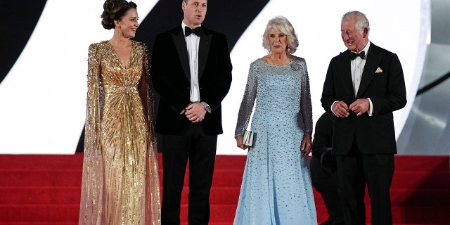 Britain's Prince Charles, at right, his wife Camilla, the Duchess of Cornwall; Kate, the Duchess of Cambridge; and her husband, Britain's Prince William, pose for photographers upon arrival for the world premiere of the new film from the James Bond franchise, "No Time To Die," in London, Sept. 28, 2021.