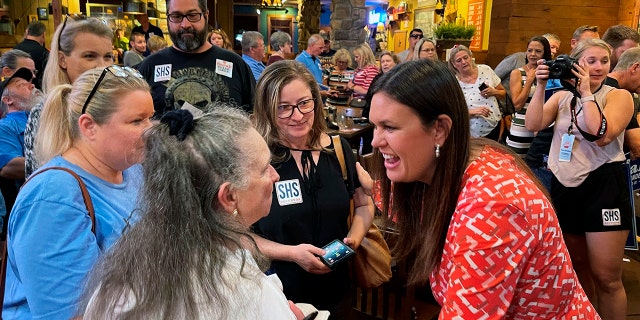 Former White House press secretary Sarah Sanders greets supporters at an event for her campaign for governor at a Colton's Steak House in Cabot, Arkansas, Friday, Sept. 10, 2021. (Associated Press)