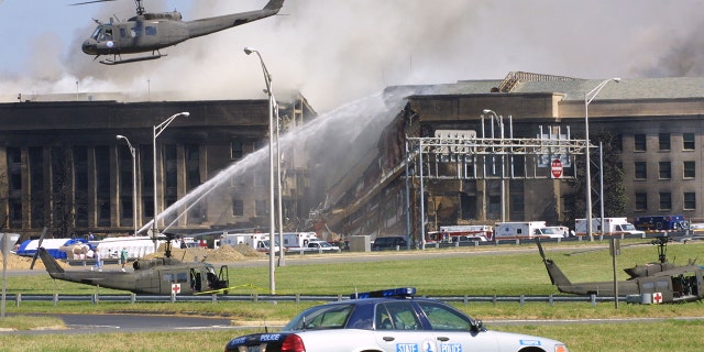 Smoke comes out from the Southwest E-ring of the Pentagon building Sept. 11, 2001 in Arlington, Virginia, after a plane crashed into the building and set off a huge explosion.