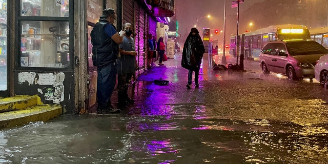 NEW YORK, NY - SEPTEMBER 01: People make their way in rainfall from the remnants of Hurricane Ida on September 1, 2021, in the Bronx borough of New York City. The once category 4 hurricane passed through New York City, dumping 3.15 inches of rain in the span of an hour at Central Park. (Photo by David Dee Delgado/Getty Images)