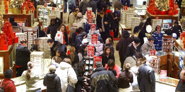 NEW YORK - DECEMBER 24: Last minute shoppers shop during the few remaining hours of shopping on Christmas eve December 24, 2004 at Macy's in New York City. Retailers suffering with disappointing seasonal sales hope to get a surge in sales due to last minute Christmas shopping. (Photo by Stephen Chernin/Getty Images)
