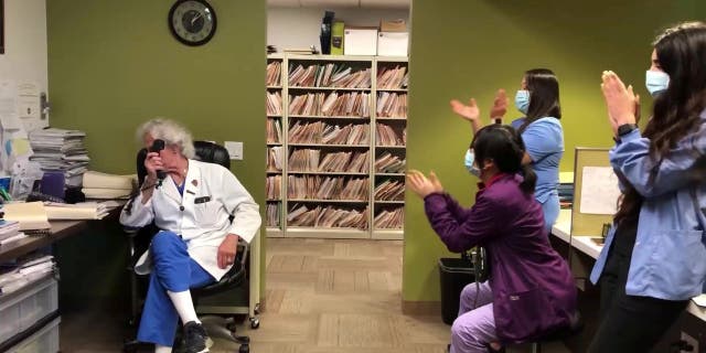 Dr. Lawrence Werlin and his team at the Coastal Fertility Medical Center join together to announce positive IVF test results.