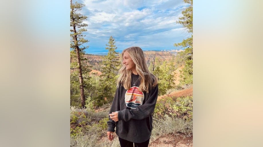 Gabby Petito wearing a brown sweater in Bryce Canyon