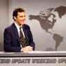 SATURDAY NIGHT LIVE -- Episode 17 -- Pictured: Norm MacDonald during the 'Weekend Update' skit on April 12, 1997 -- 