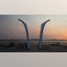 The sun rises behind the Postcards 9/11 memorial by New York architect Masayuki Sono on Staten Island New York on July 30, 2021. Built in 2004, it is a permanent memorial honoring the 274 Staten Island residents killed in the September 11 attacks of 2001 and in the 1993 World Trade Center bombing. Twenty years later, tucked between the buildings and boroughs of New York City, memorials and reminders can be found of a day that left nearly 3,000 people dead  ensuring the city that never sleeps will also never forget. (Photo by KENA BETANCUR/AFP via Getty Images)