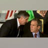 U.S. President George W. Bush listens as White House Chief of Staff Andrew Card informs him of a second plane hitting the World Trade Center while Bush was conducting a reading seminar at the Emma E. Booker Elementary School in Sarasota, Fla., in this Sept. 11, 2001, file photo. (REUTERS/Win McNamee-Files HB)