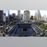 Families visit the South Memorial Pool during ceremonies at the World Trade Center site in New York, U.S., September 11, 2011. (Robert Deutsch/Pool via REUTERS)