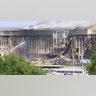 Smoke comes out from the Southwest E-ring of the Pentagon building Sept. 11, 2001, in Arlington, Va., after a plane crashed into the building and set off a huge explosion. (Photo by Alex Wong/Getty Images)