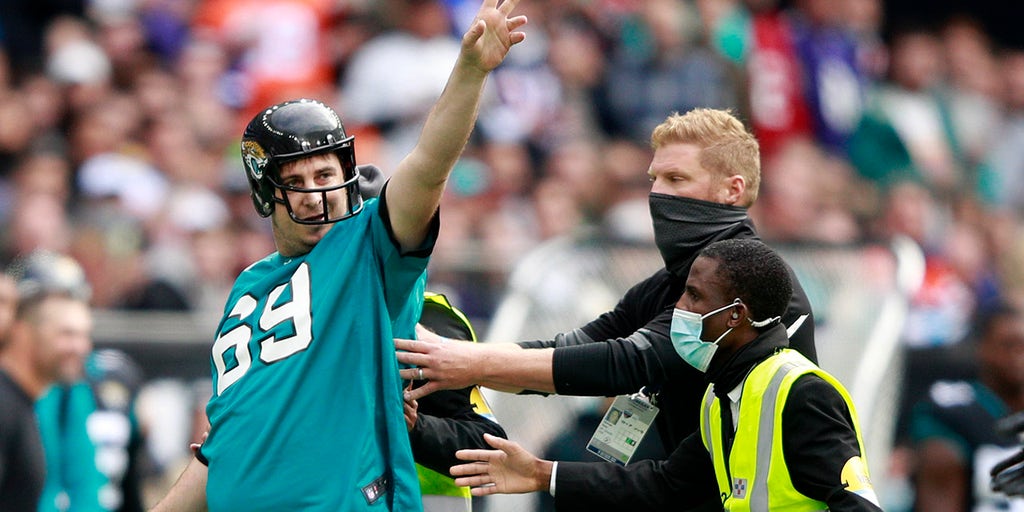 Fan runs on the field during Jaguars touchdown run