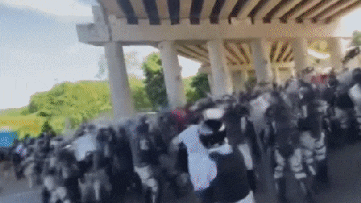 Shocking video of combative caravan breaking through security on way to US