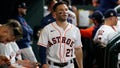 Houston Astros' Jose Altuve walks in the dugout during the sixth inning of Game 1 in baseball's World Series between the Houston Astros and the Atlanta Braves Tuesday, Oct. 26, 2021, in Houston.