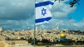 Israeli flag flying over Jerusalem.