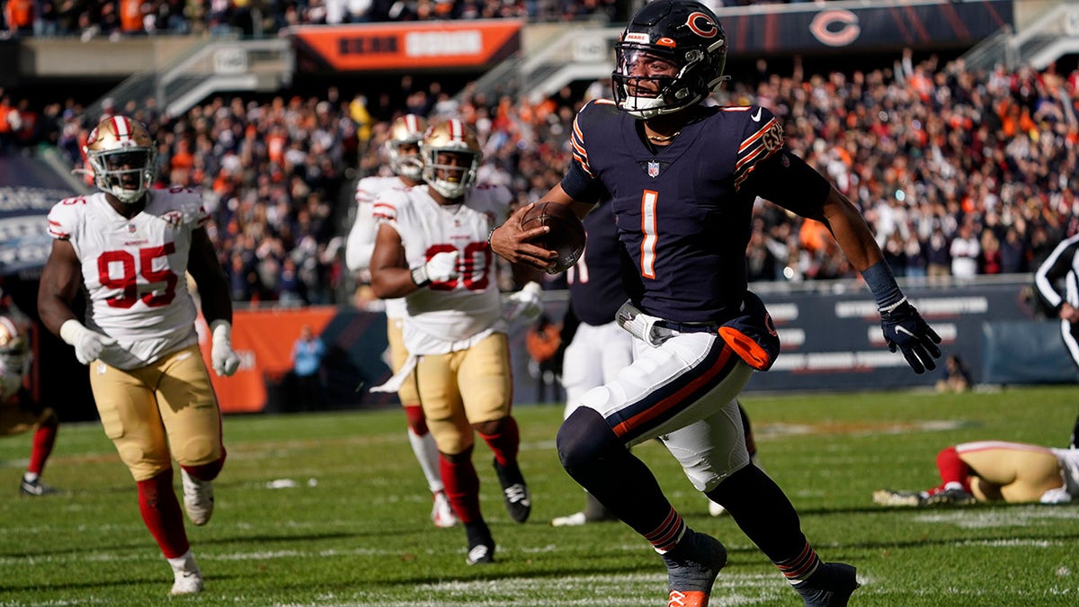 Chicago Bears quarterback Justin Fields runs for the end zone and a touchdown against the San Francisco 49ers during the second half Sunday, Oct. 31, 2021, in Chicago.