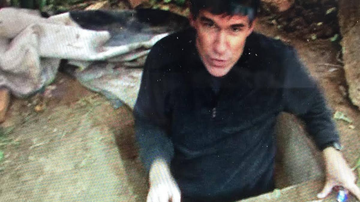 Fox News correspondent Greg Palkot at Saddam Hussein's "Spider Hole" in 2003.