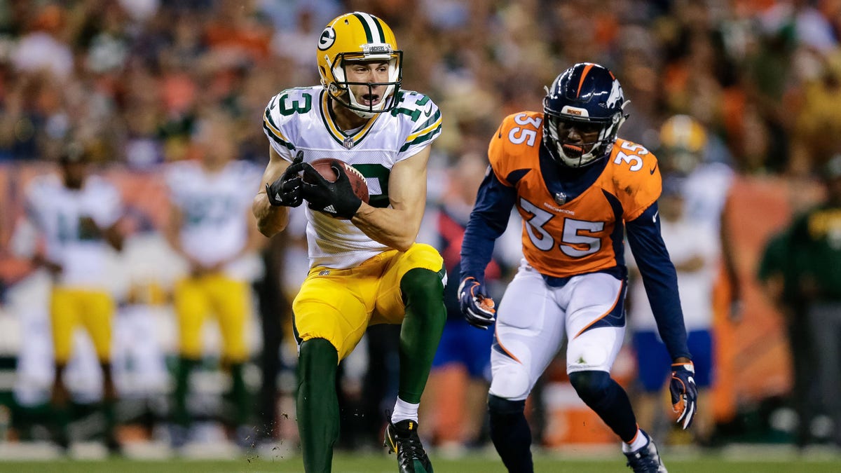 Aug 26, 2017; Denver, CO, USA; Green Bay Packers wide receiver Max McCaffrey (13) makes a catch ahead of Denver Broncos safety Dymonte Thomas (35) in the third quarter at Sports Authority Field at Mile High. Mandatory Credit: Isaiah J. Downing-USA TODAY Sports